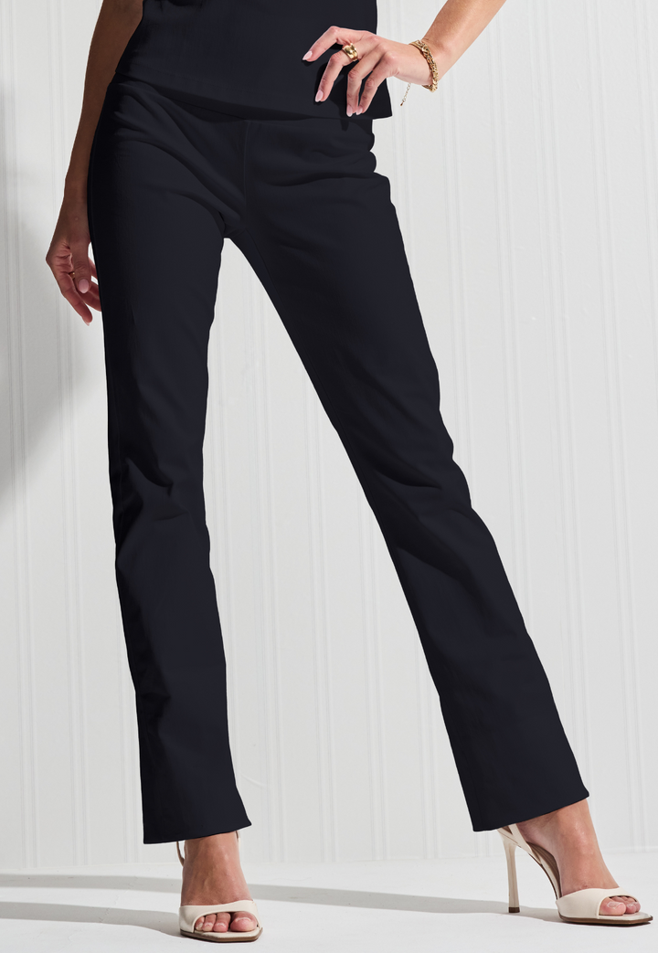Woman wearing Gabriele black Italian stretch cotton pants against a white background