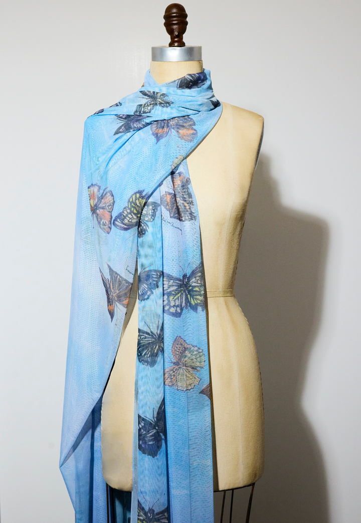 Gala sheer mesh wrap in Papillon featuring blue butterfly artwork