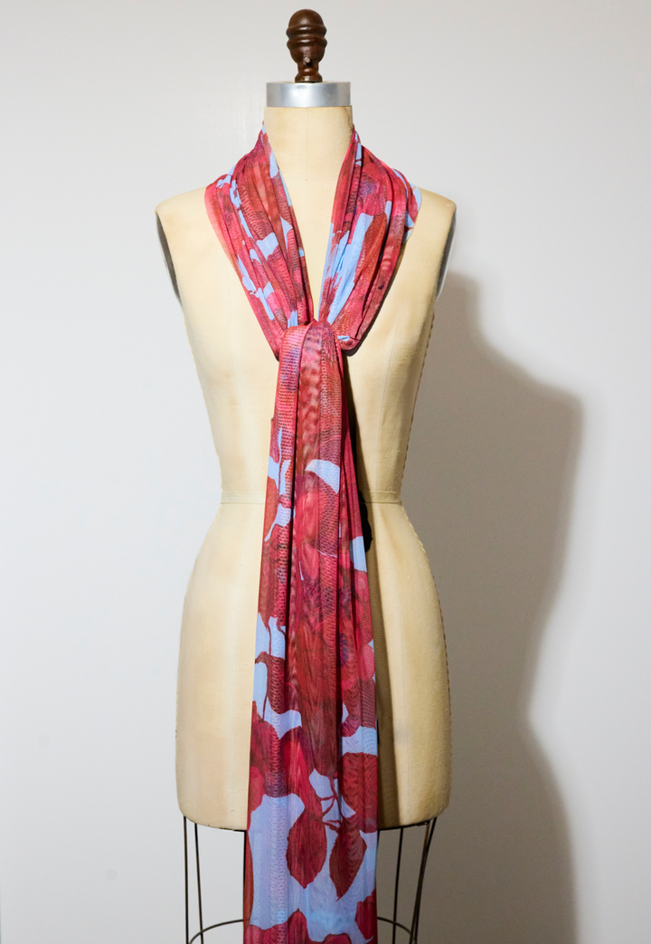 Woman wearing Gala Raspberry Grandiflora sheer mesh wrap
