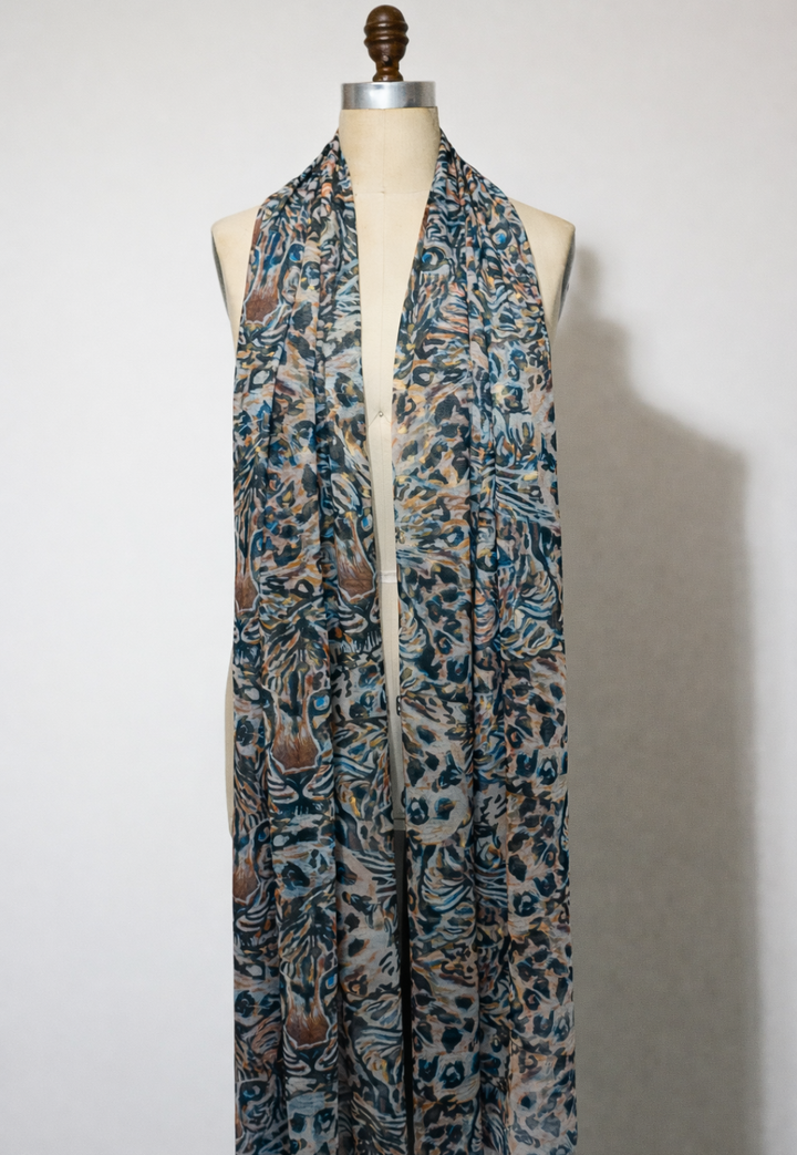 Gala sheer mesh wrap in Snow Leopard draped on mannequin