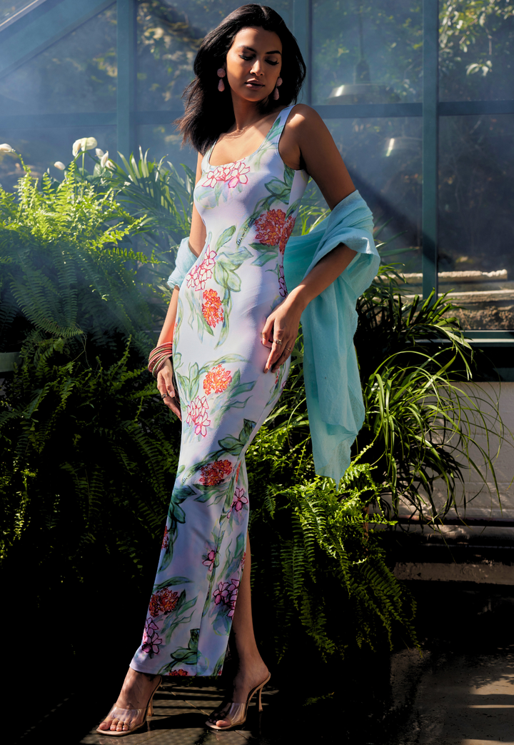 Woman wearing Illusion Blue cashmere shawl over a long floral dress