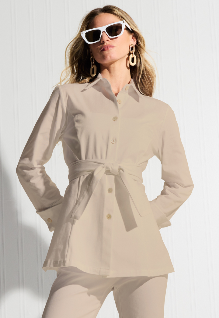 Woman wearing Keaton khaki Italian stretch cotton blouse with self-tie belt and sunglasses