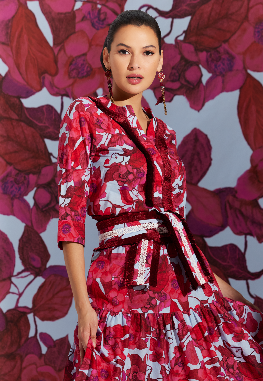 Woman wearing Liza Raspberry Grandiflora red floral cotton tunic