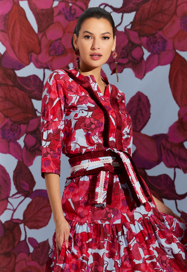 Woman wearing Liza Raspberry Grandiflora red floral cotton tunic