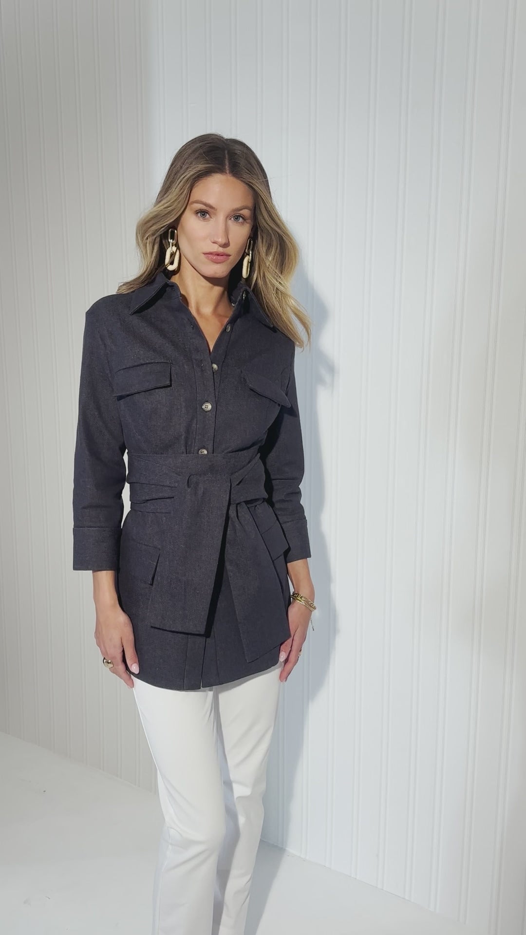 Video of a woman wearing a denim jacket with white cotton pants and a denim skirt by designer Ala von Auersperg for womens luxury travel clothing