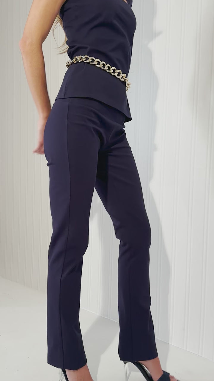 Woman wearing navy blue cotton tank top and pants by designer Ala von Auersperg for womens luxury travel clothing