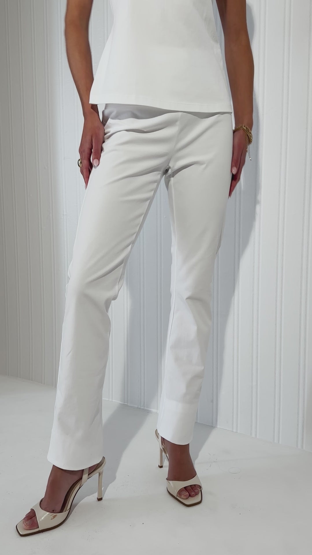Woman wearing white pants styled with pieces by Ala von Auersperg 