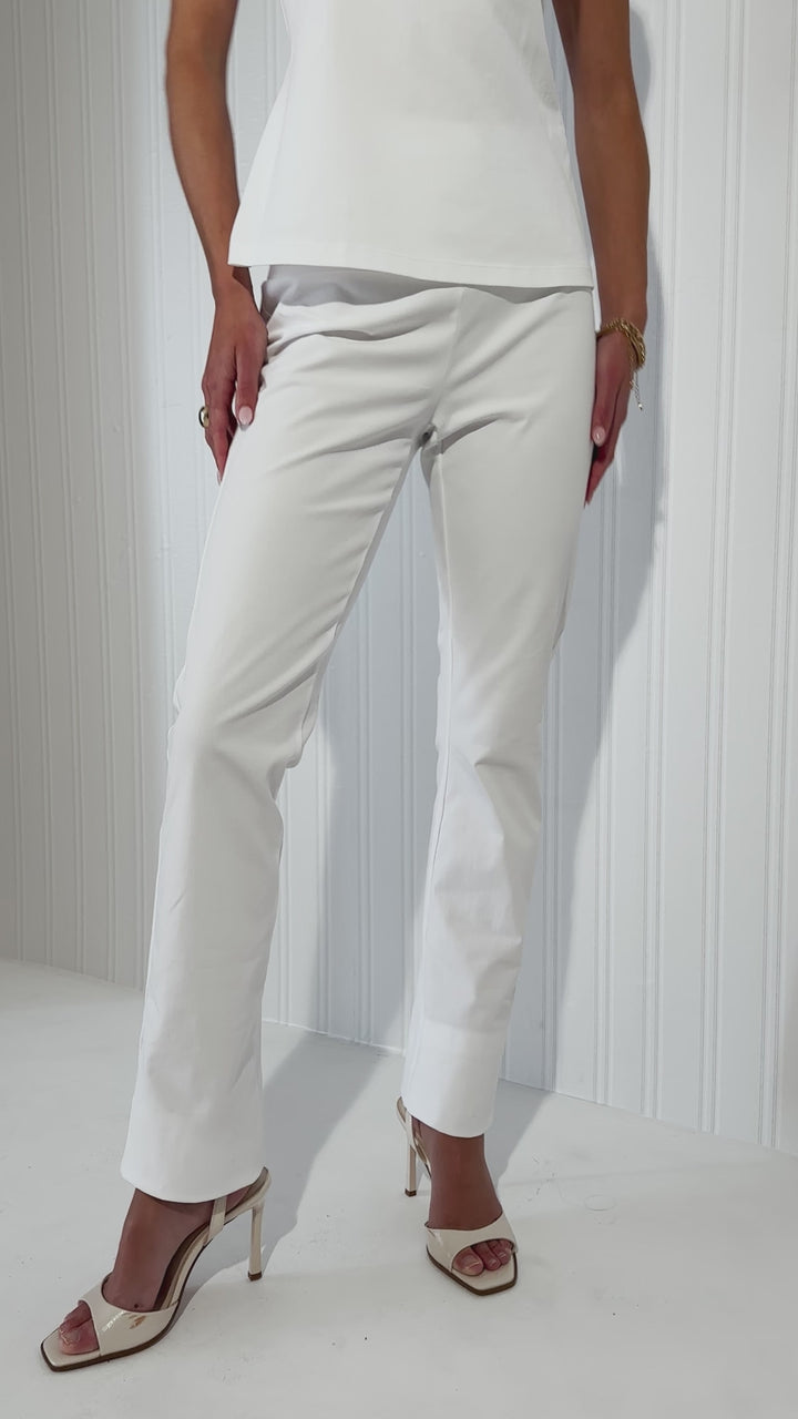Woman wearing white pants styled with pieces by Ala von Auersperg 