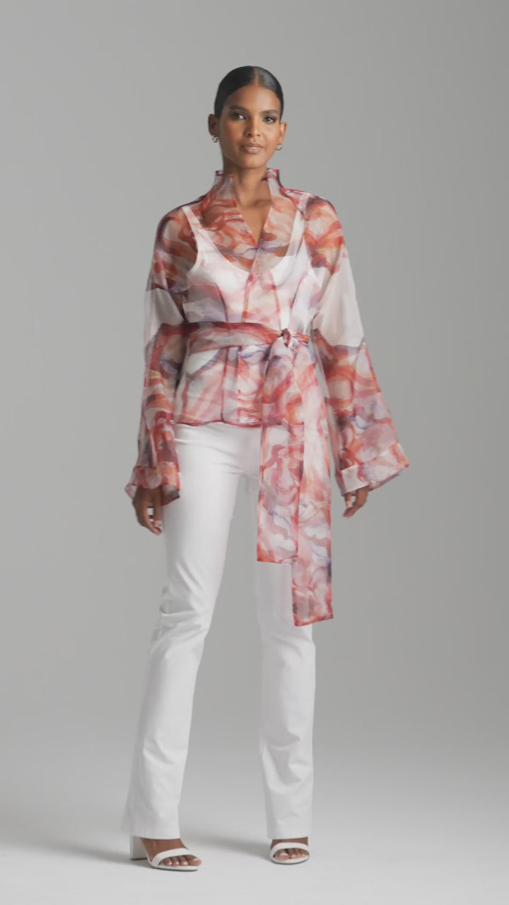 Woman wearing red rose printed silk organza kimono blouse with high neckline and belt over italian stretch cotton white tank top and pants by Ala von Auersperg