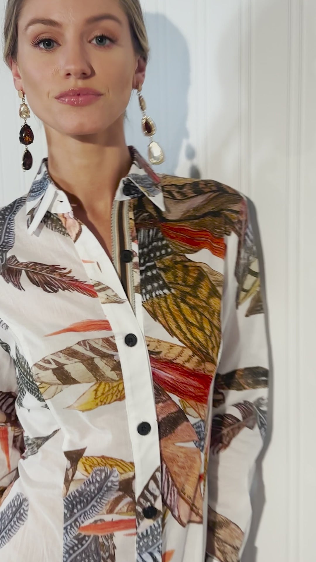 Video of a woman wearing a feather printed cotton shirtdress by designer Ala von Auersperg