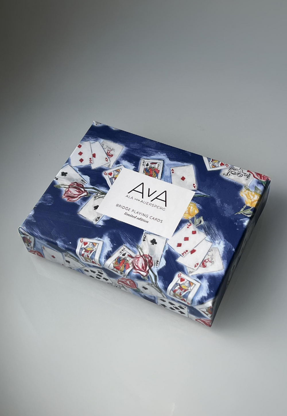 Red and blue playing card decks in Dealer's Choice print box