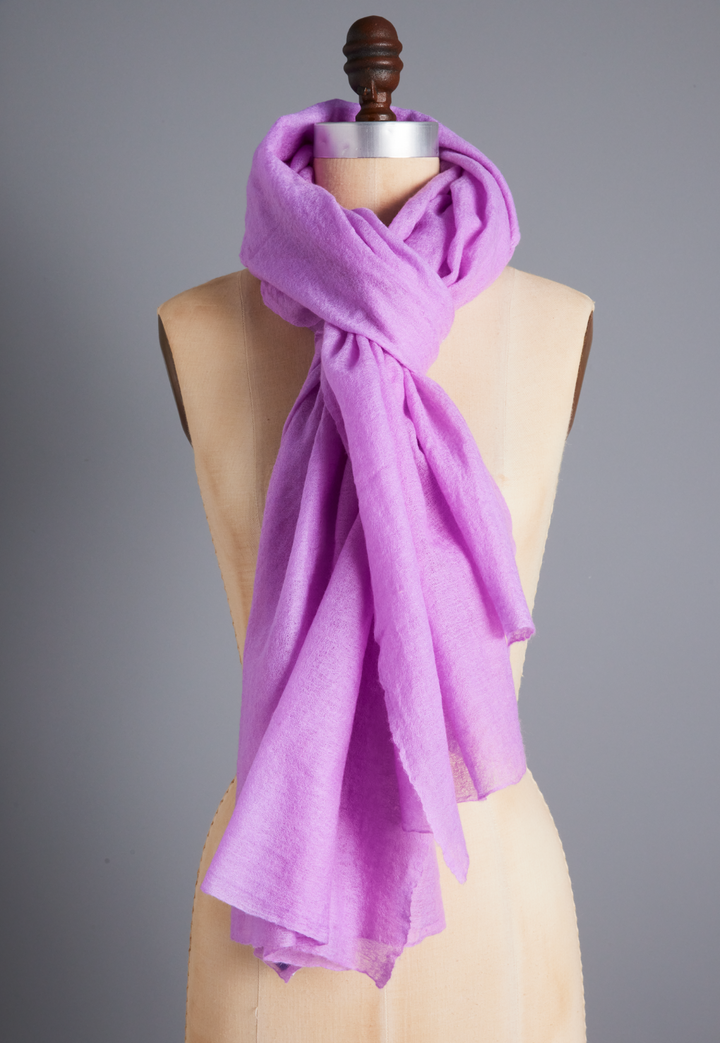 Sheer Lilac purple cashmere wrap draped around a dress form as a long scarf