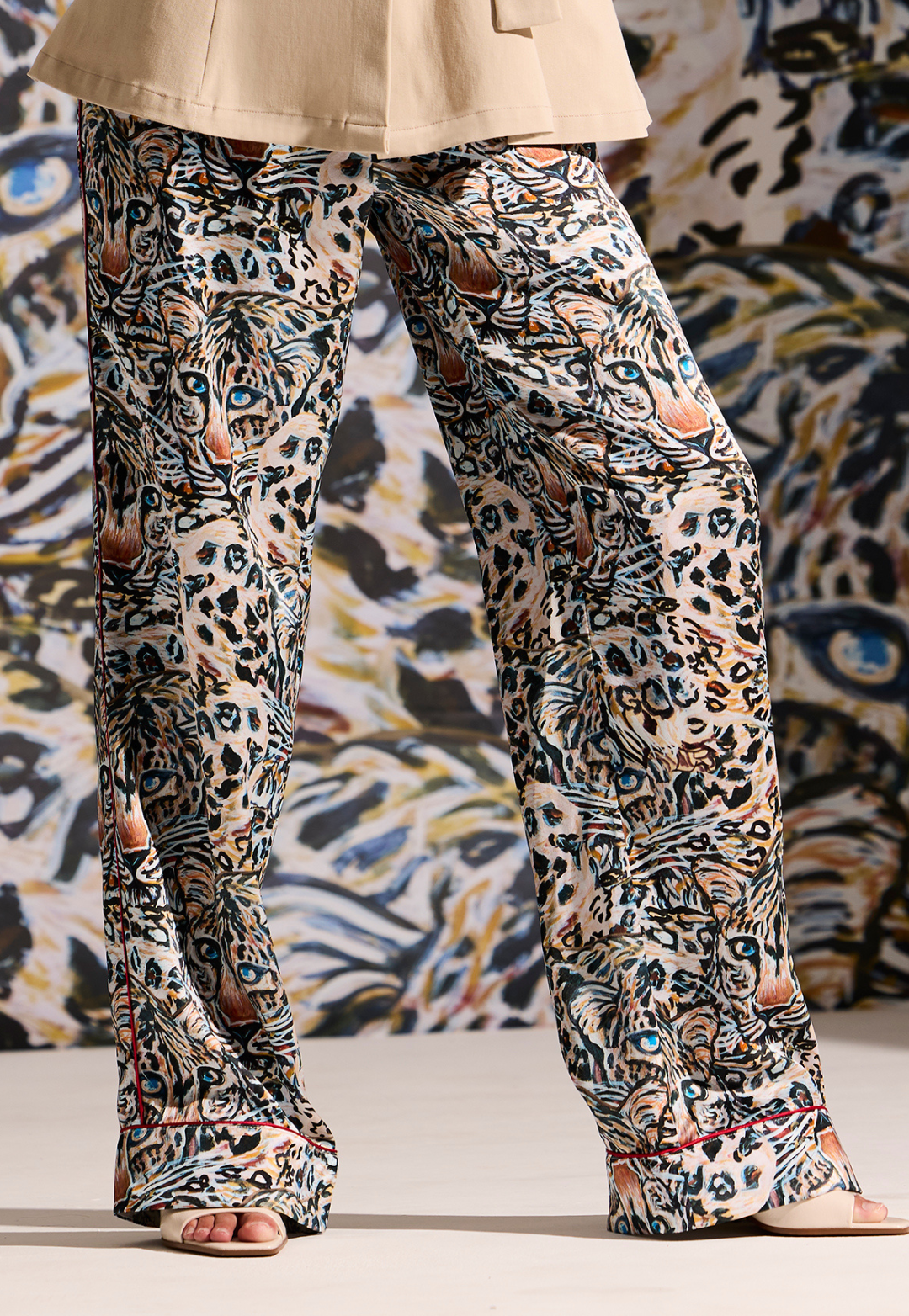 Woman wearing Sobel Snow Leopard silk pajama pants