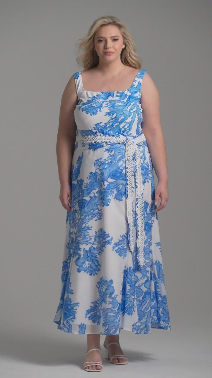 Woman wearing blue coral printed cotton voile long skirt with blue coral printed square neck stretch knit tank top by Ala von Auersperg for resort 2023