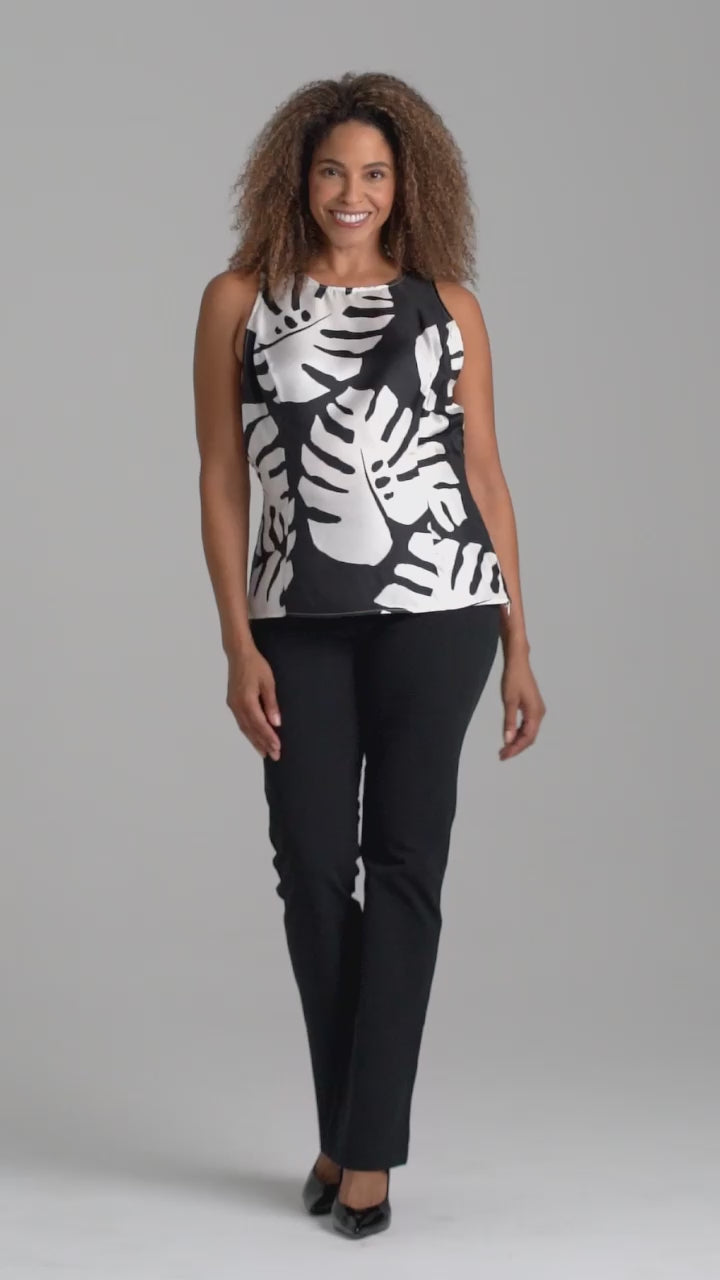 Woman wearing black and white palm leaf printed silk shell tank top with italian stretch cotton black pants by Ala von Auersperg for holiday 2022