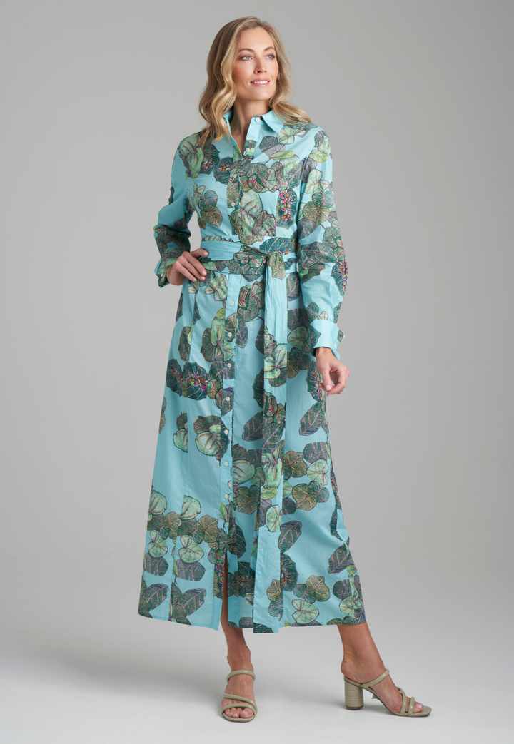 Woman wearing grape leave printed cotton green shirt dress by Ala von Auersperg for resort 2022