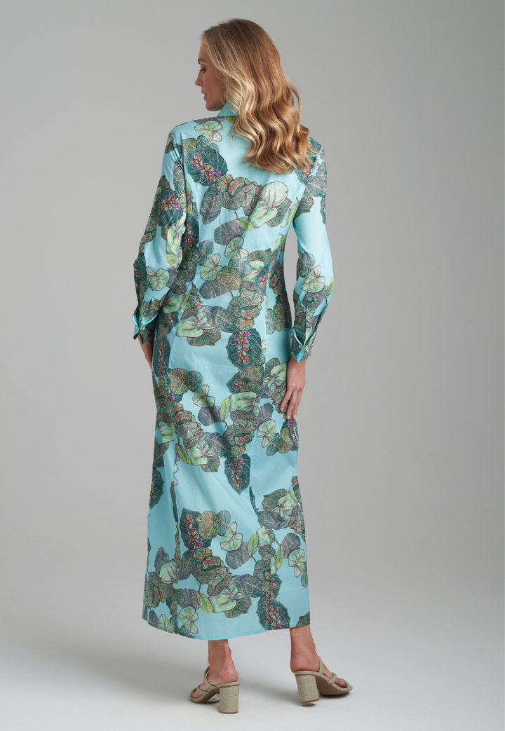 Woman wearing grape leave printed cotton green shirt dress by Ala von Auersperg for resort 2022