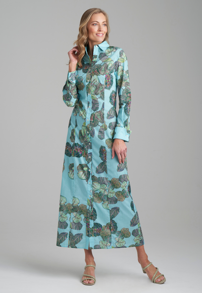 Woman wearing grape leave printed cotton green shirt dress by Ala von Auersperg for resort 2022