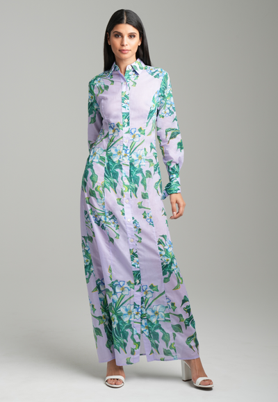 Woman wearing lavender mock coffee cotton printed long shirt dress by Ala von Auersperg for resort 2023