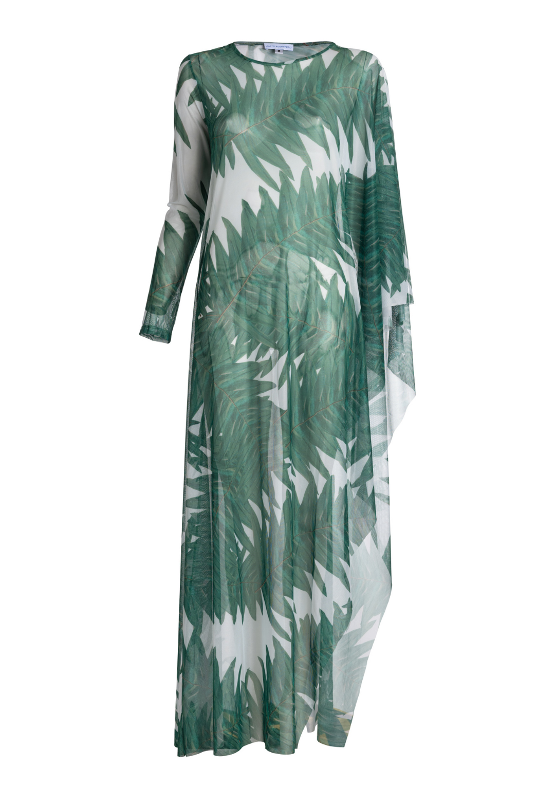 Woman wearing on armed mesh green palm leaf printed kaftan poncho over italian stretch cotton white tank top and green palm leaf printed stretch knit pants by Ala von Auersperg