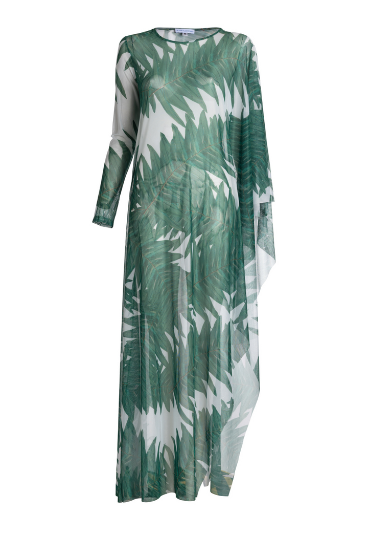 Woman wearing on armed mesh green palm leaf printed kaftan poncho over italian stretch cotton white tank top and green palm leaf printed stretch knit pants by Ala von Auersperg