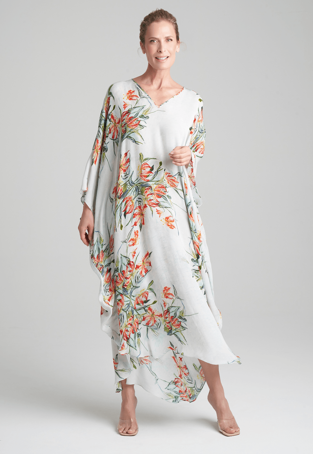 woman wearing blue spider lily printed v neck silk kaftan by Ala von Auersperg