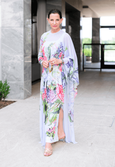 Tiffany Blackmon wearing sheer mesh one sleeved poncho kaftan floral printed by Ala von Auersperg for spring summer 2022