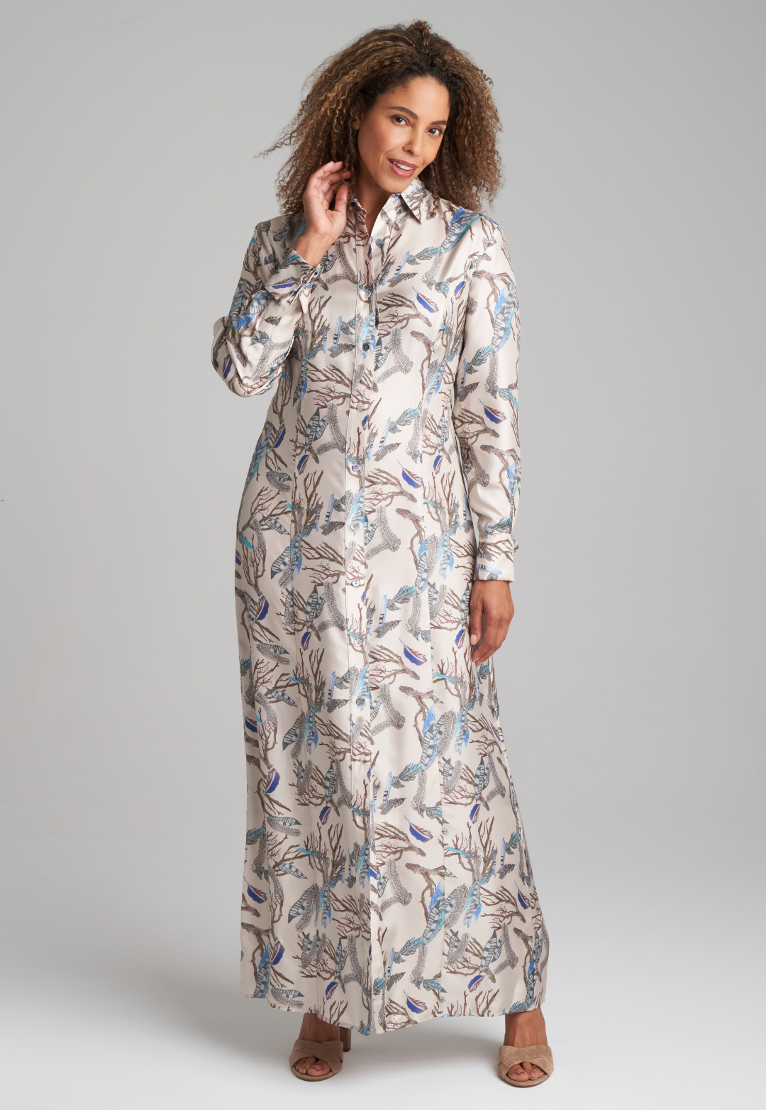 Woman wearing silk feather printed shirt dress by Ala von Auersperg for fall 2022