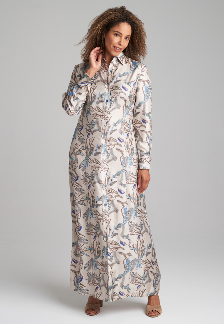 Woman wearing silk feather printed shirt dress by Ala von Auersperg for fall 2022