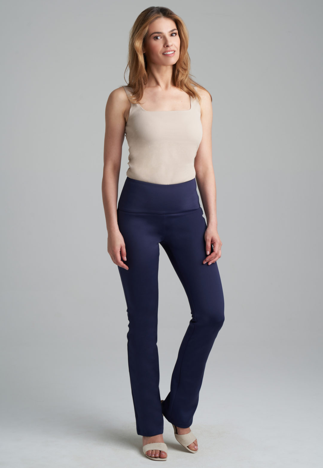 Woman wearing khaki stretch knit square neck tank top and stretch knit navy pants by Ala von Auersperg