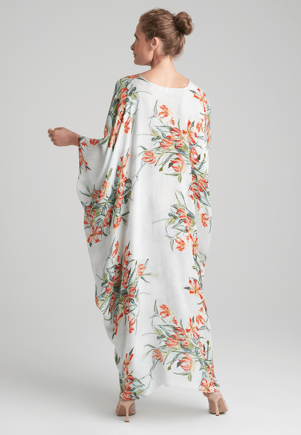 woman wearing blue spider lily printed v neck silk kaftan by Ala von Auersperg