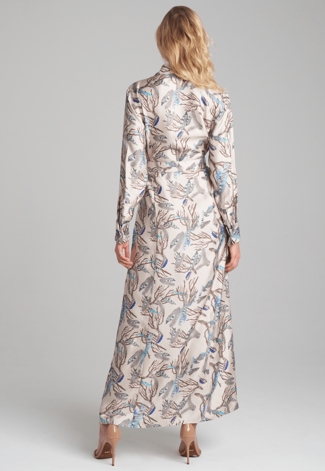 Woman wearing silk feather printed shirt dress by Ala von Auersperg for fall 2022