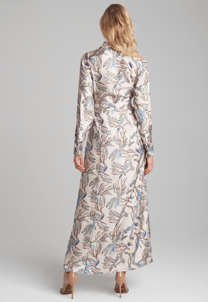 Woman wearing silk feather printed shirt dress by Ala von Auersperg for fall 2022