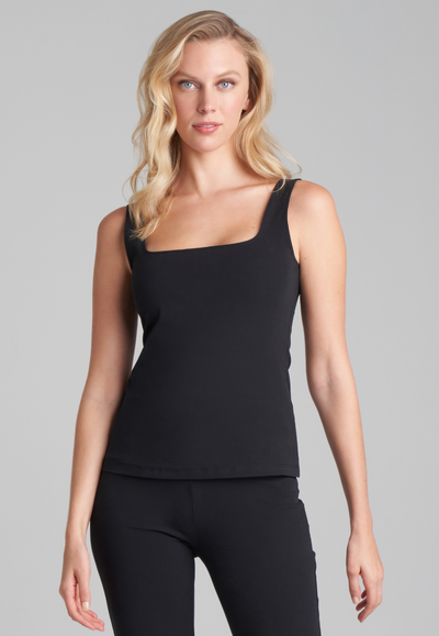 Woman wearing italian stretch cotton black square neck tank top and pant by Ala von Auersperg for holiday 2022