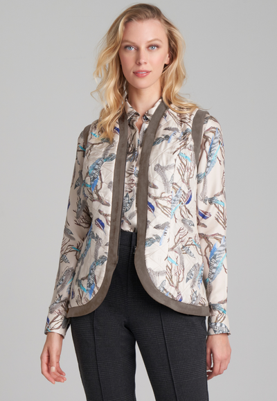 Woman wearing feather printed silk quilted vest over feather printed silk blouse by Ala von Auersperg for fall 2022