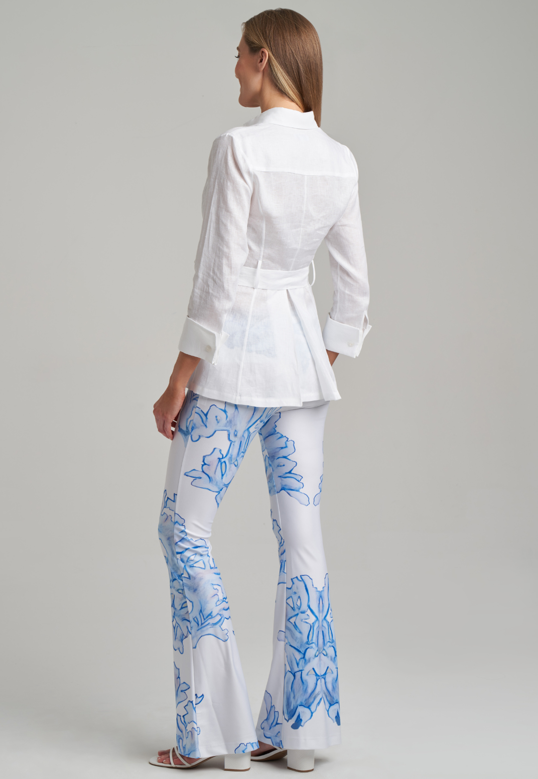Model wearing white linen blouse with printed stretch knit pants