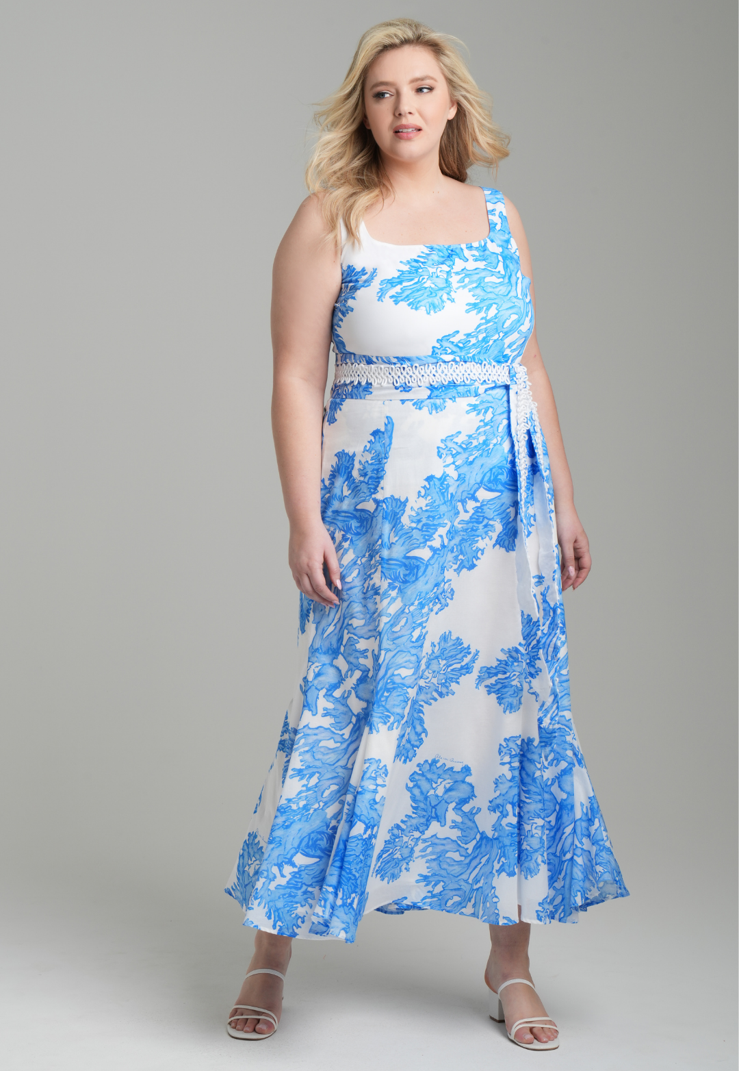 Woman wearing blue coral printed cotton voile long skirt with blue coral printed square neck stretch knit tank top by Ala von Auersperg for resort 2023