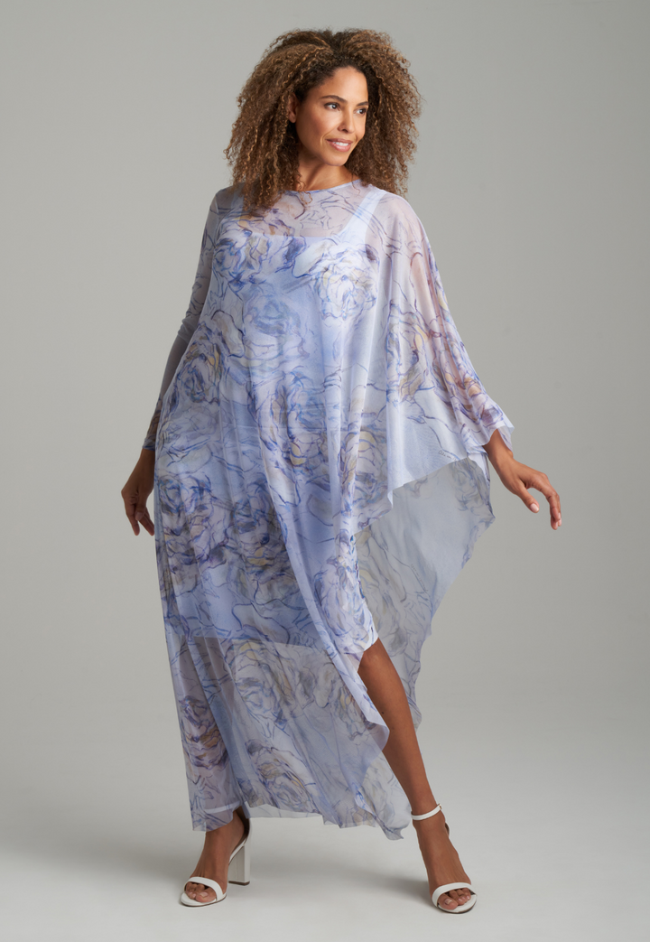 Woman wearing blue rose printed short square neck stretch knit dress with blue rose printed mesh poncho by Ala von Auersperg for spring summer 2022
