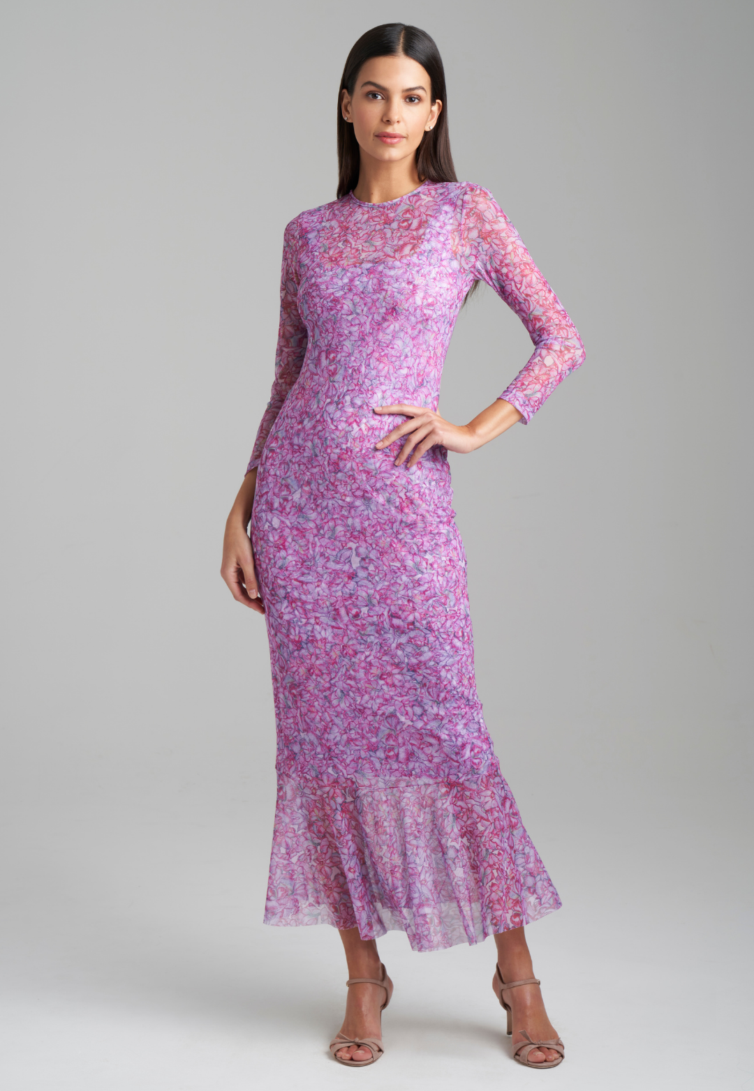 Woman wearing stretch knit pink printed orchid flowers short dress with pink printed orchid mesh dress by Ala von Auersperg for resort 2022