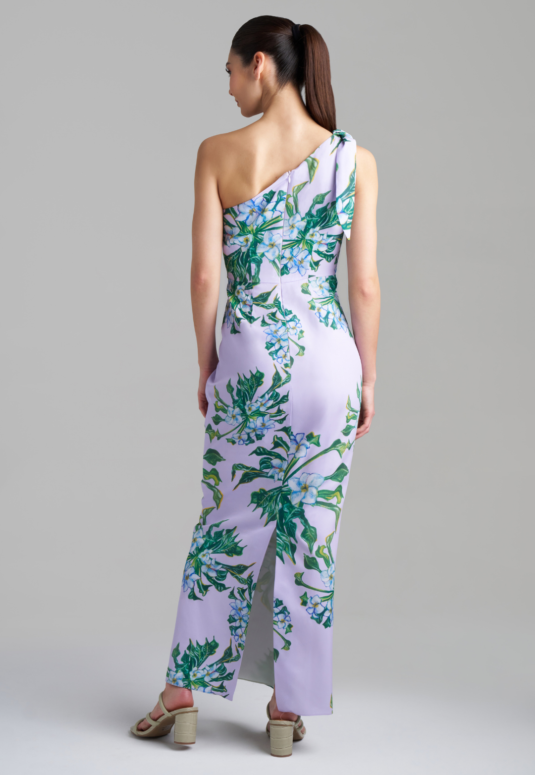 Woman wearing lavender mock coffee printed silk one shoulder long dress by Ala von Auersperg