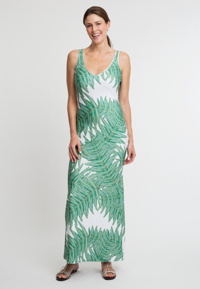 Woman wearing stretch knit v neck green palm printed dress by Ala von Auersperg 
