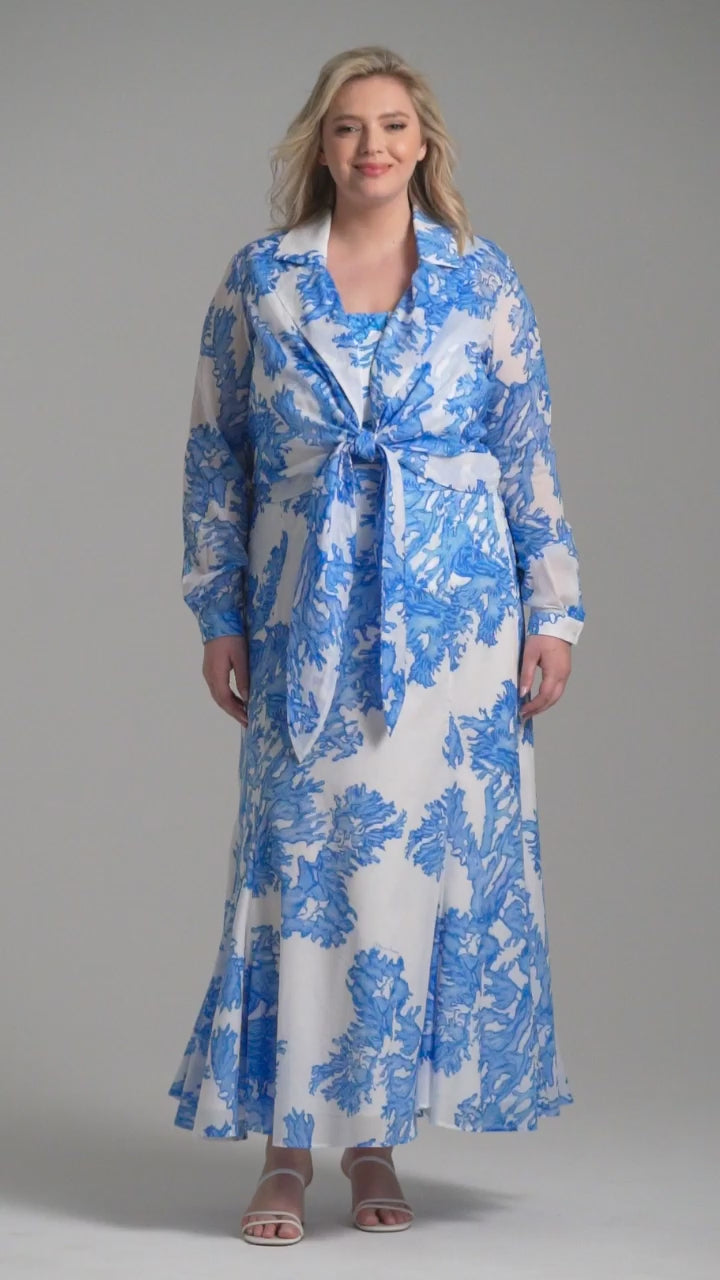 Woman wearing blue coral printed cotton voile long skirt with blue coral printed square neck stretch knit tank top and blue coral printed cotton wrap top by Ala von Auersperg for resort 2023