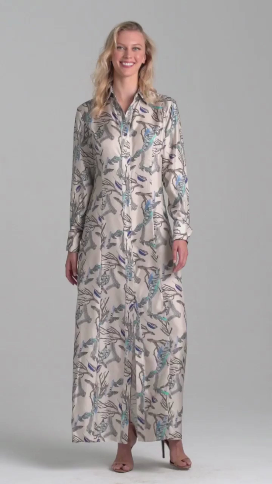 Woman wearing silk feather printed shirt dress by Ala von Auersperg for fall 2022