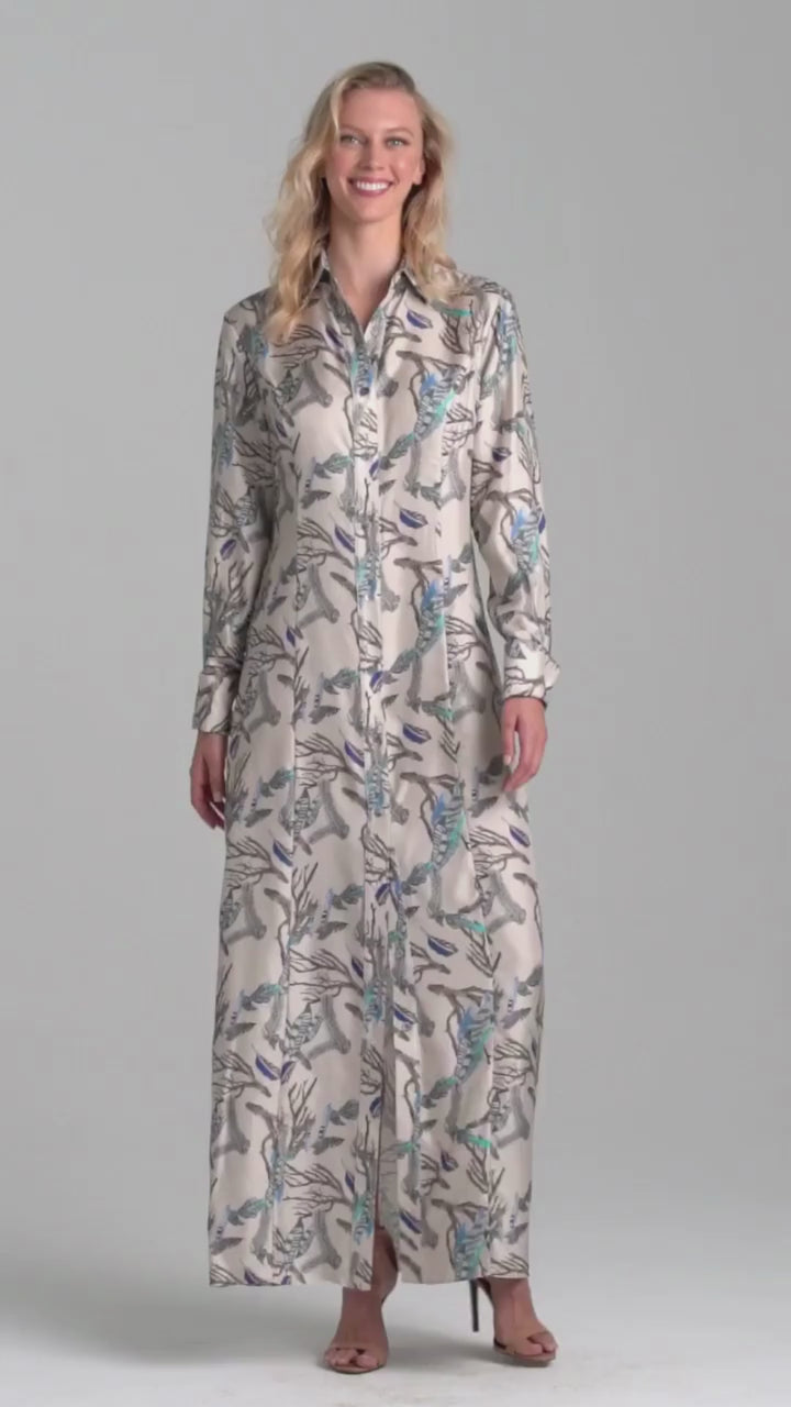 Woman wearing silk feather printed shirt dress by Ala von Auersperg for fall 2022