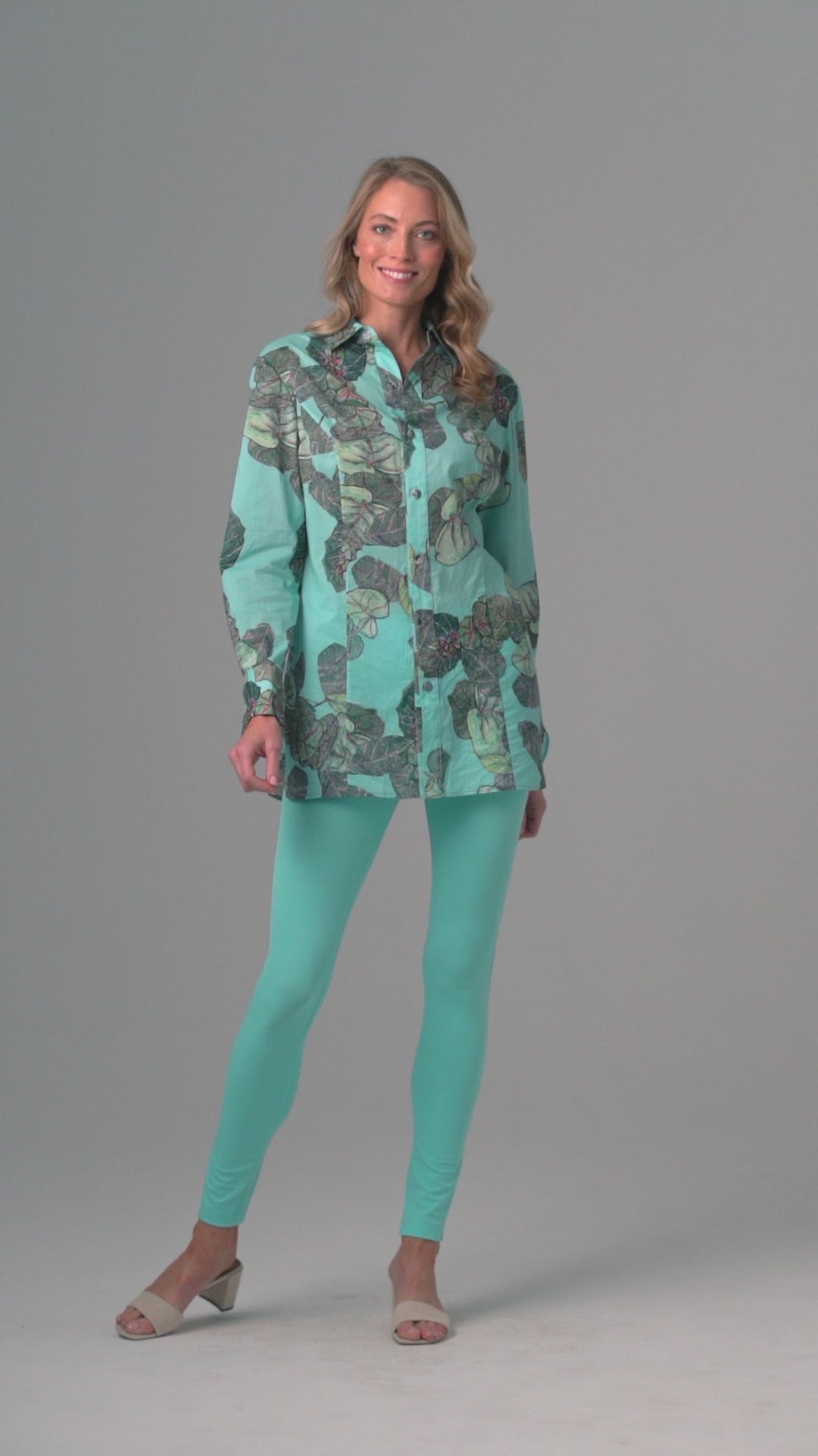 Woman wearing grape leaf cotton blouse with stretch knit blue pants by Ala von Auersperg for resort 2022