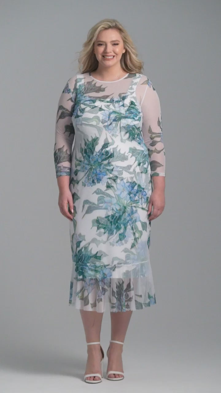 Woman wearing green mock coffee printed mesh dress with ruffle bottom over stretch knit mock coffee square necks short dress by Ala von Auersperg for resort 2023