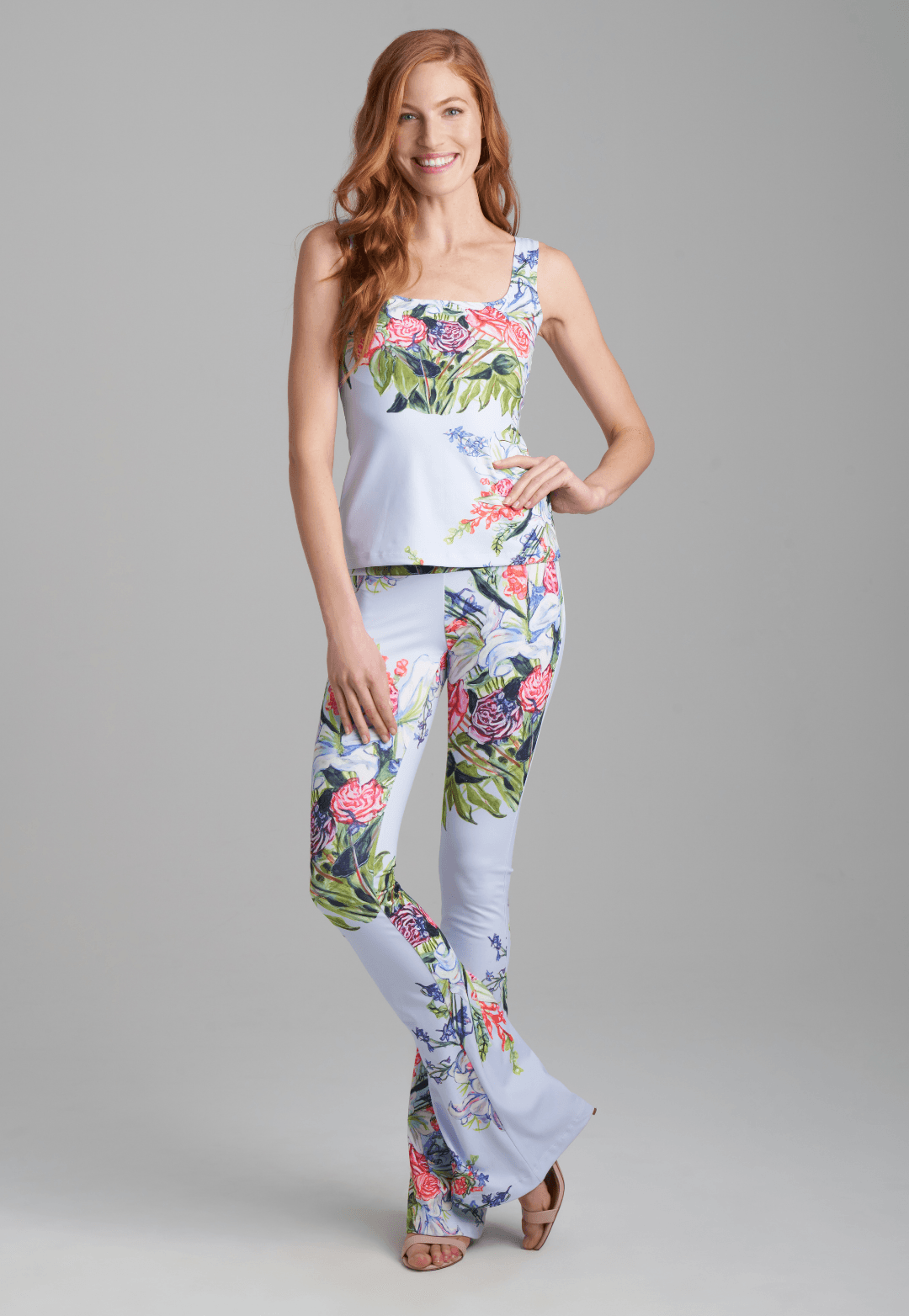 Woman wearing floral bouquet printed square neck stretch knit tank top and stretch knit floral bouquet printed pants by Ala von Auersperg for spring summer 2022