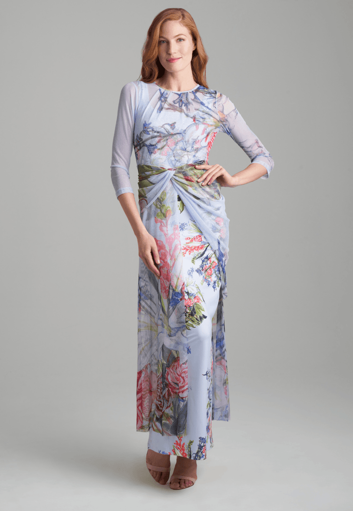 Woman wearing sheer mesh asymmetrical  floral bouquet printed topper over floral bouquet printed stretch knit dress by Ala von Auersperg for spring summer 2022