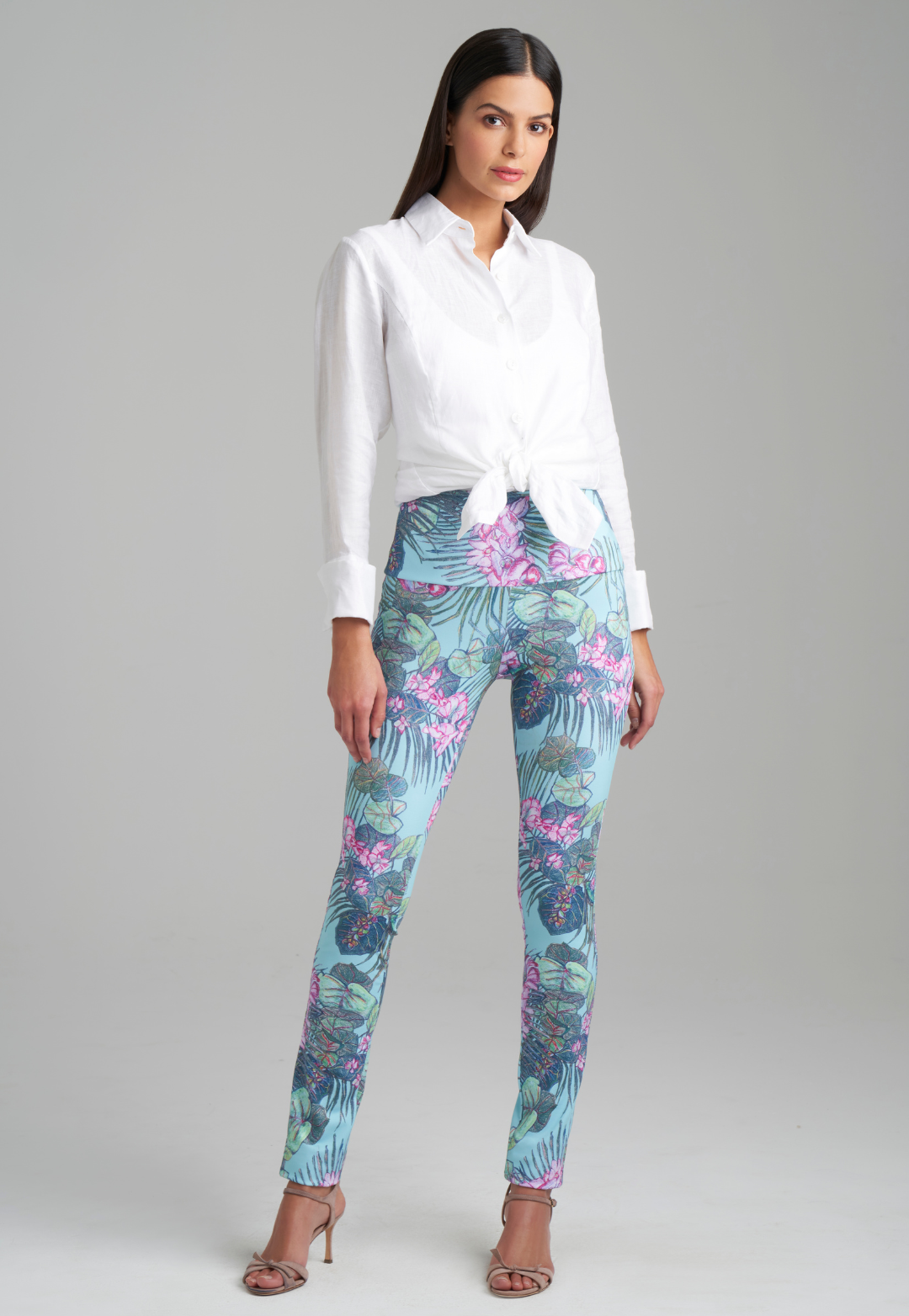 Model wearing white linen blouse with printed stretch knit pants