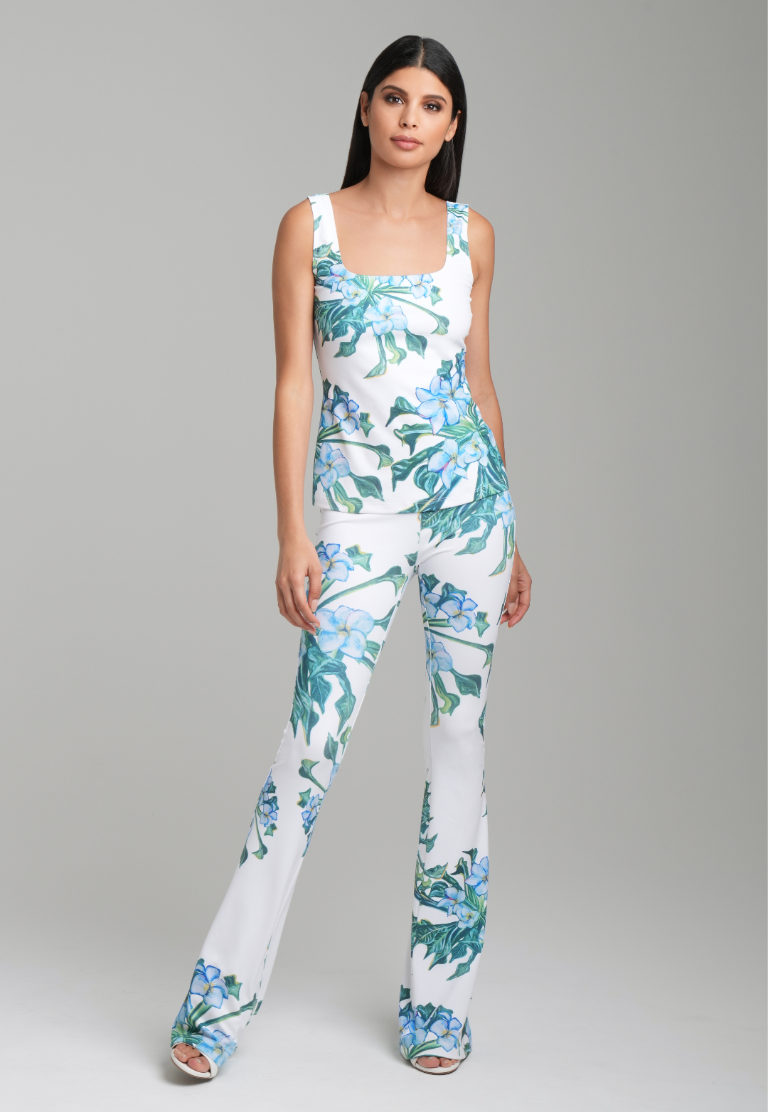 Woman wearing green mock coffee square neck stretch knit tank top with green mock coffee printed stretch knit pants by Ala von Auersperg for resort 2023